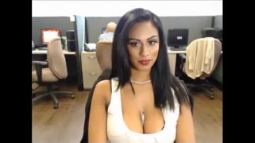 Office girl shows some boobie at her desk