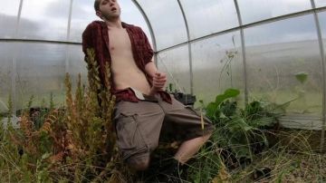 Horny dude masturbating in the field