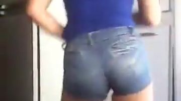 Amateur in short jean shorts shakes her ass while her friend records